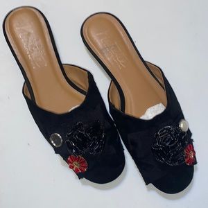 Nanette Lapore, 7.5 black embellished fabrics, slides.  Left pearl missing